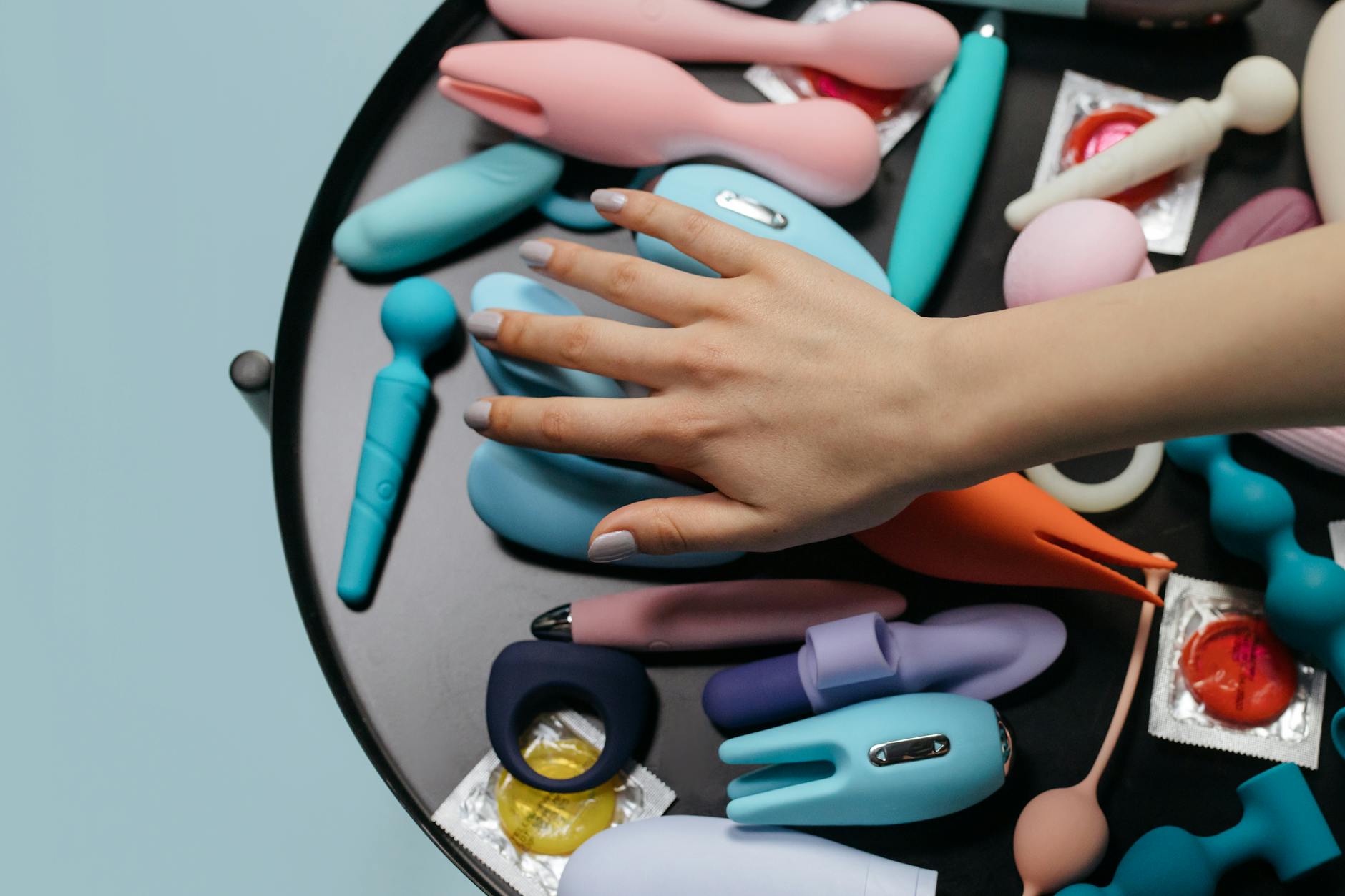 A colorful arrangement of lemon vibrators and pleasure devices on a bright yellow surface