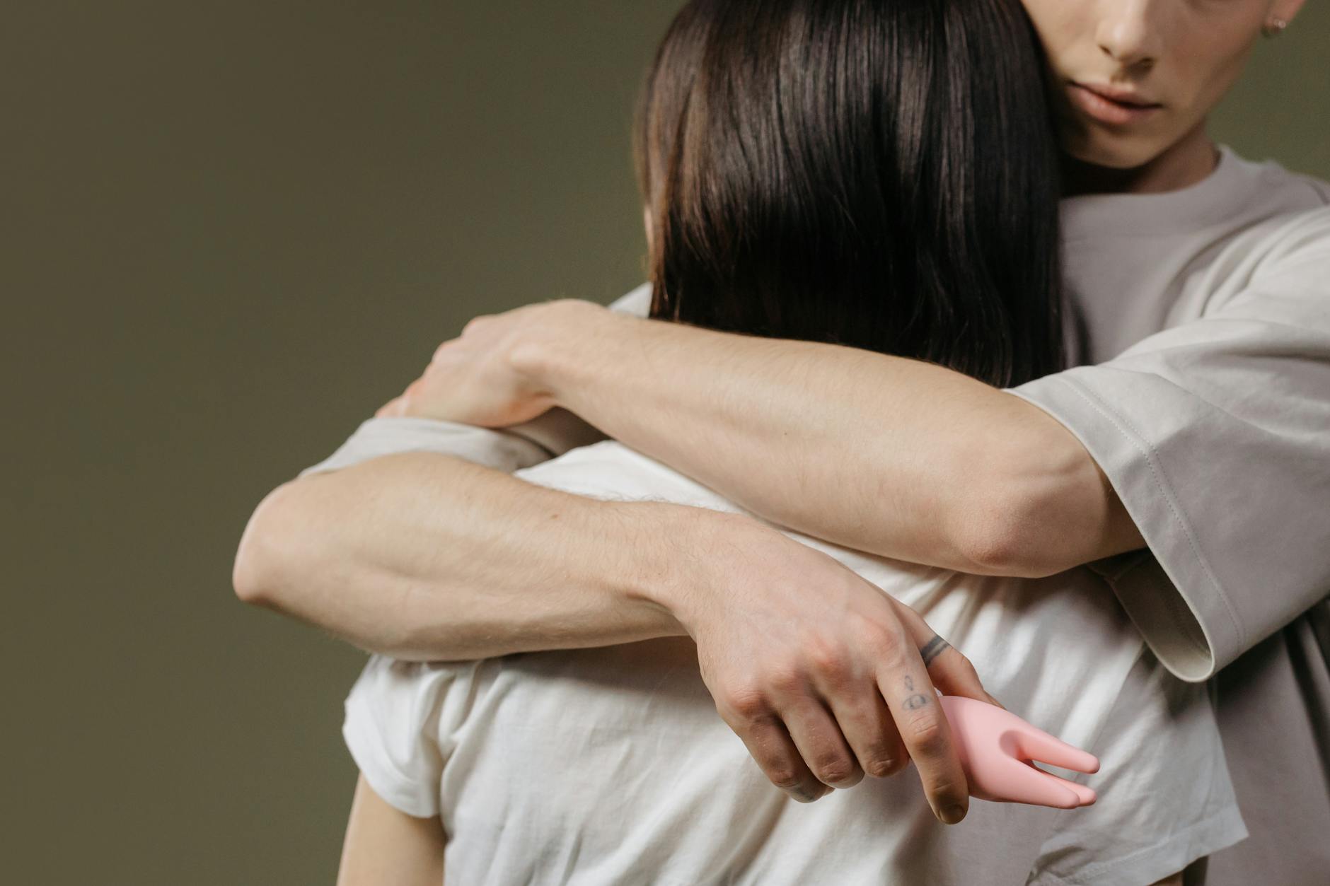 Close-up of a couple embracing, highlighting intimacy and connection in a relationship moment.